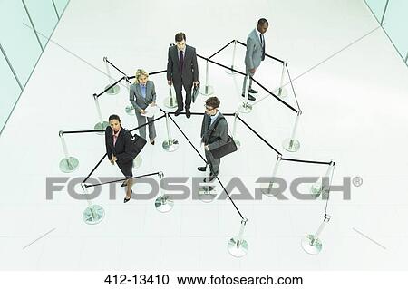 Business people waiting in roped off area View Large Photo Image Stock Image - Business people waiting in roped off area. Fotosearch