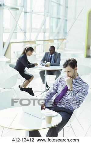 Business people working in office lobby View Large Photo Image Stock Image - Business people working in office lobby. Fotosearch