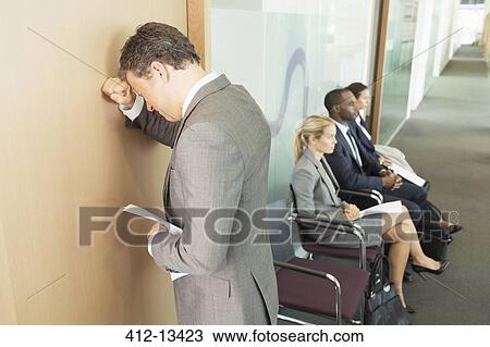 Businessman leaning on office door View Large Photo Image Stock Image - Businessman leaning on office door. Fotosearch