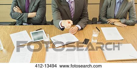 Businessman shaking his finger in meeting View Large Photo Image Picture - Businessman shaking his finger in meeting. Fotosearch
