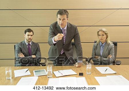 Businessman shaking his finger in meeting View Large Photo Image Stock Image - Businessman shaking his finger in meeting. Fotosearch