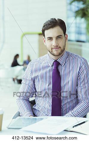 Businessman sitting in office View Large Photo Image Picture - Businessman sitting in office. Fotosearch