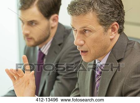 Businessman talking in meeting View Large Photo Image Stock Photograph - Businessman talking in meeting. Fotosearch