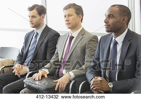 Businessmen sitting in waiting area View Large Photo Image Stock Image - Businessmen sitting in waiting area. Fotosearch