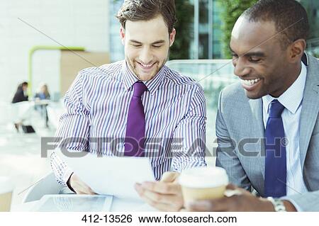 Businessmen talking at cafe View Large Photo Image Stock Photograph - Businessmen talking at cafe. Fotosearch