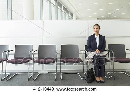 Businesswoman sitting in waiting area View Large Photo Image Stock Photo - Businesswoman sitting in waiting area. Fotosearch