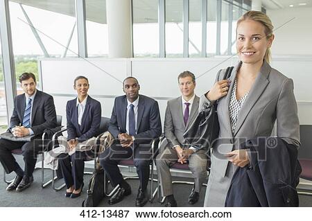 Stock Photo - Businesswoman smiling in office. Fotosearch