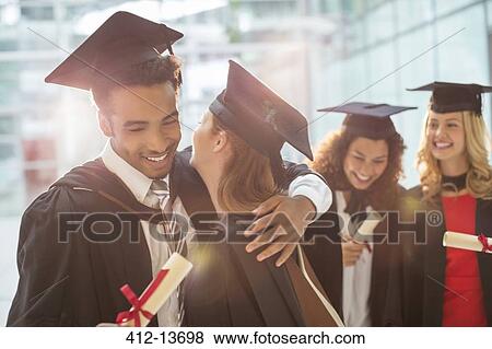 Graduates hugging View Large Photo Image Stock Photo - Graduates hugging. Fotosearch
