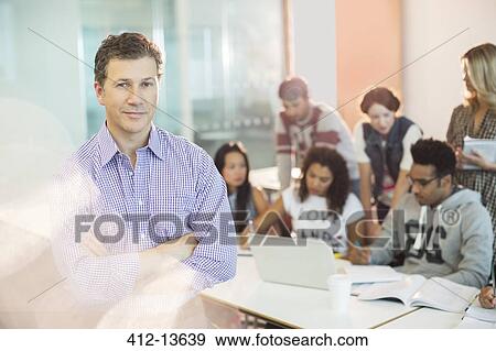 Professor standing in classroom View Large Photo Image Stock Photo - Professor standing in classroom. Fotosearch