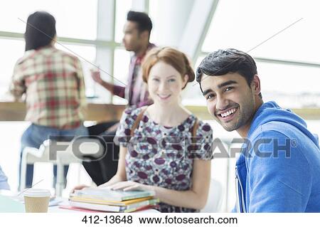 Students smiling in cafe View Large Photo Image Stock Photo - Students smiling in cafe. Fotosearch