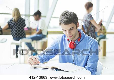 University student reading in cafe View Large Photo Image Stock Image - University student reading in cafe. Fotosearch