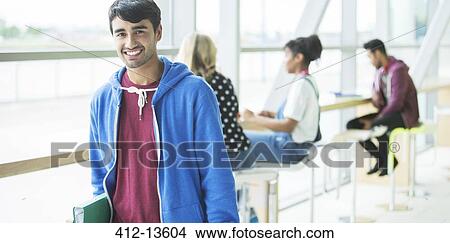 Picture - University student smiling in cafe. Fotosearch