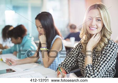 University student smiling in classroom View Large Photo Image Stock Image - University student smiling in classroom. Fotosearch