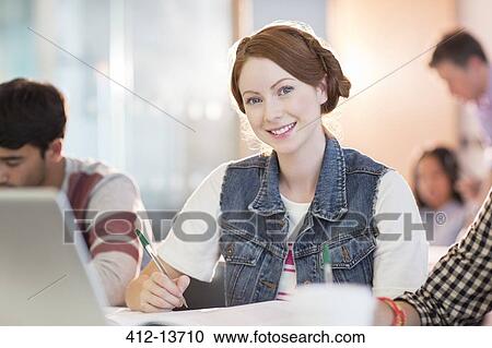 University student smiling in classroom View Large Photo Image Stock Image - University student smiling in classroom. Fotosearch