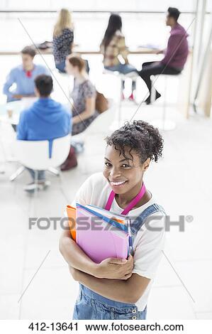 University student smiling in lounge View Large Photo Image Stock Image - University student smiling in lounge. Fotosearch