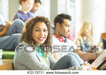 University student smiling in lounge View Large Photo Image Stock Image - University student smiling in lounge. Fotosearch