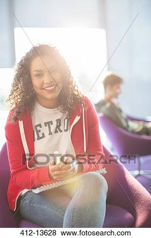 University student smiling in lounge View Large Photo Image Stock Photo - University student smiling in lounge. Fotosearch