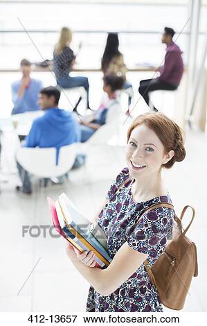 University student smiling in lounge View Large Photo Image Stock Photo - University student smiling in lounge. Fotosearch