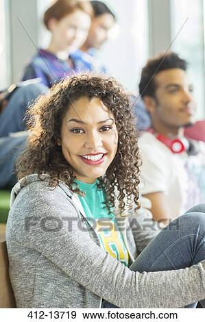 University student smiling in lounge View Large Photo Image Stock Photo - University student smiling in lounge. Fotosearch