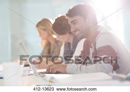 University student using laptop in classroom View Large Photo Image Stock Image - University student using laptop in classroom. Fotosearch
