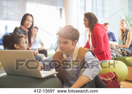 University student using laptop in lounge View Large Photo Image Stock Photo - University student using laptop in lounge. Fotosearch