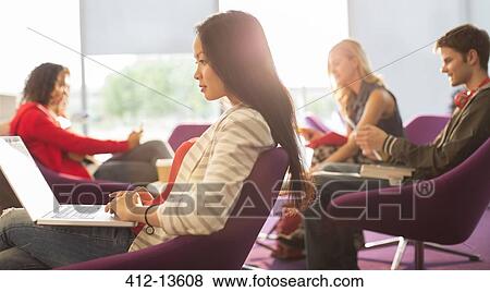 University student using laptop in lounge View Large Photo Image Stock Photo - University student using laptop in lounge. Fotosearch