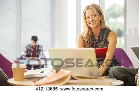 University student using laptop in lounge View Large Photo Image Stock Photography - University student using laptop in lounge. Fotosearch