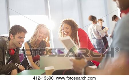 Stock Image - University students in lounge. Fotosearch