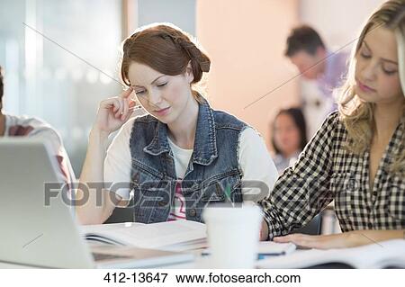 University students reading in class View Large Photo Image Stock Photo - University students reading in class. Fotosearch