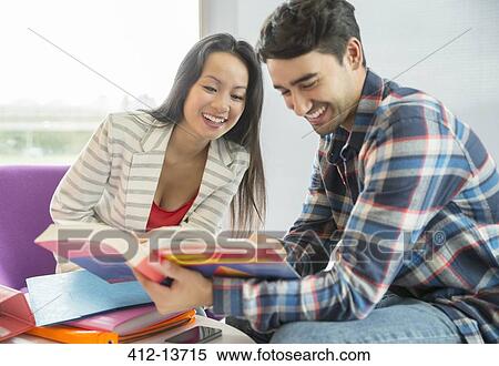 University students reading textbook in lounge View Large Photo Image Stock Photography - University students reading textbook in lounge. Fotosearch