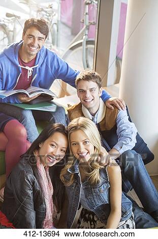 University students smiling in lounge View Large Photo Image Picture - University students smiling in lounge. Fotosearch