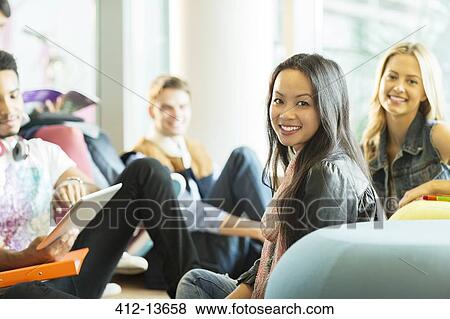 University students smiling in lounge View Large Photo Image Stock Photo - University students smiling in lounge. Fotosearch