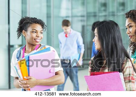University students talking in corridor View Large Photo Image Stock Image - University students talking in corridor. Fotosearch