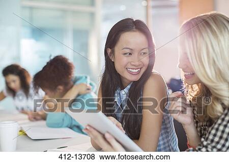 University students using digital tablet in classroom View Large Photo Image Stock Photo - University students using digital tablet in classroom. Fotosearch