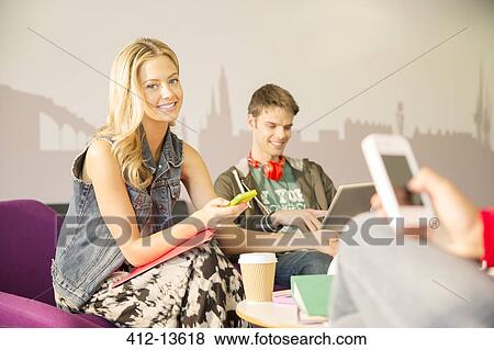 University students using technology in lounge View Large Photo Image Stock Photo - University students using technology in lounge. Fotosearch