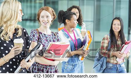 University students walking with books View Large Photo Image Stock Photo - University students walking with books. Fotosearch