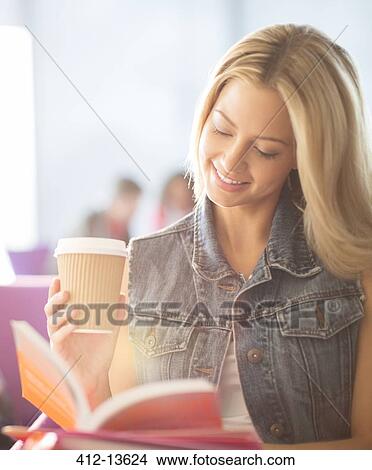 Woman reading and drinking coffee View Large Photo Image Picture - Woman reading and drinking coffee. Fotosearch