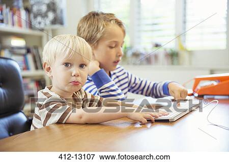 Children using computer together View Large Photo Image Stock Photo - Children using computer together. Fotosearch