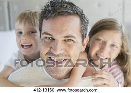 Father and children hugging View Large Photo Image Stock Image - Father and children hugging. Fotosearch