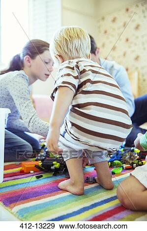 Father and children playing together View Large Photo Image Stock Photo - Father and children playing together. Fotosearch