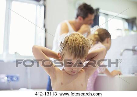Father and children washing up in bathroom View Large Photo Image Stock Image - Father and children washing up in bathroom. Fotosearch