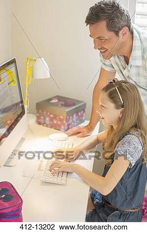 Father and daughter using computer together View Large Photo Image Stock Image - Father and daughter using computer together. Fotosearch