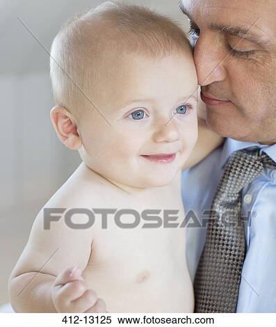 Stock Photography - Father holding baby. Fotosearch