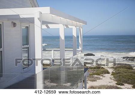 Beach house and balcony overlooking ocean View Large Photo Image Stock Photo - Beach house and balcony overlooking ocean. Fotosearch
