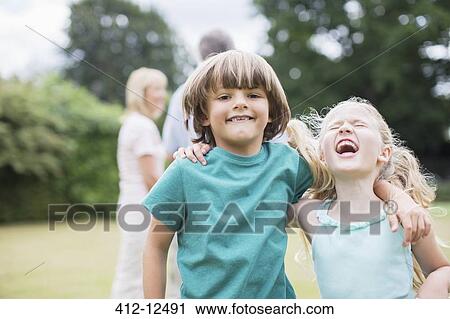 Children playing together outdoors View Large Photo Image Stock Image - Children playing together outdoors. Fotosearch