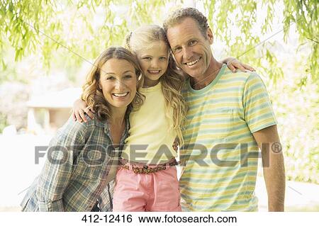 Family smiling together outdoors View Large Photo Image Stock Photograph - Family smiling together outdoors. Fotosearch