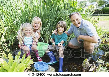 Grandparents and grandchildren fishing with nets View Large Photo Image Stock Image - Grandparents and grandchildren fishing with nets. Fotosearch