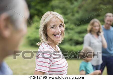 Stock Photography - Multi-generation family outdoors. Fotosearch