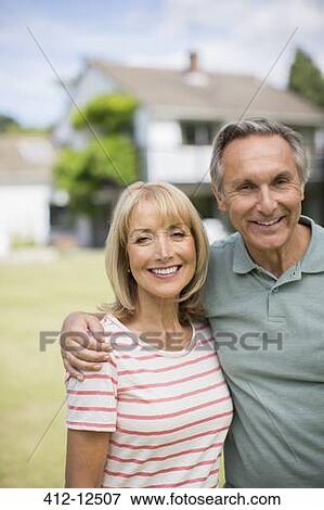 Senior couple hugging outdoors View Large Photo Image Stock Photo - Senior couple hugging outdoors. Fotosearch