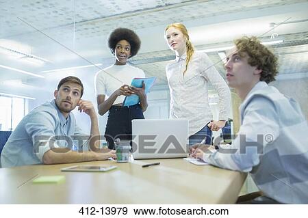 Stock Photo - Business people meeting in conference room. Fotosearch